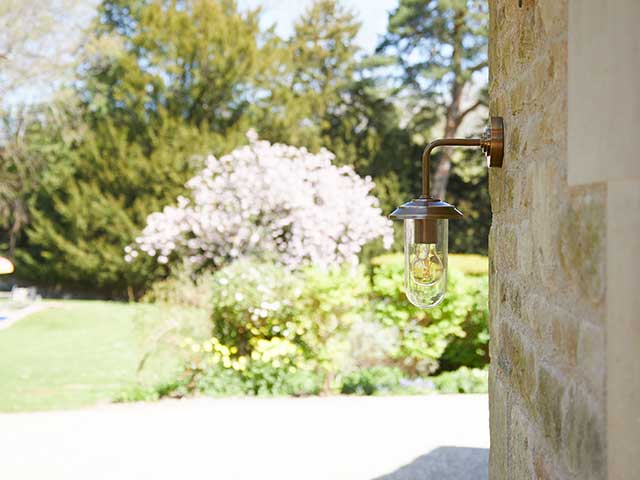 Brass light in garden cabincore set up