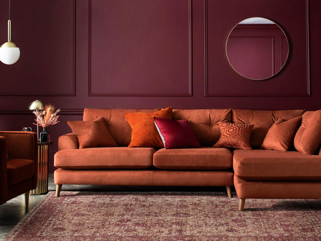 sofa trends 2022: colour drenching with burnt orange sofa from next and burgundy walls
