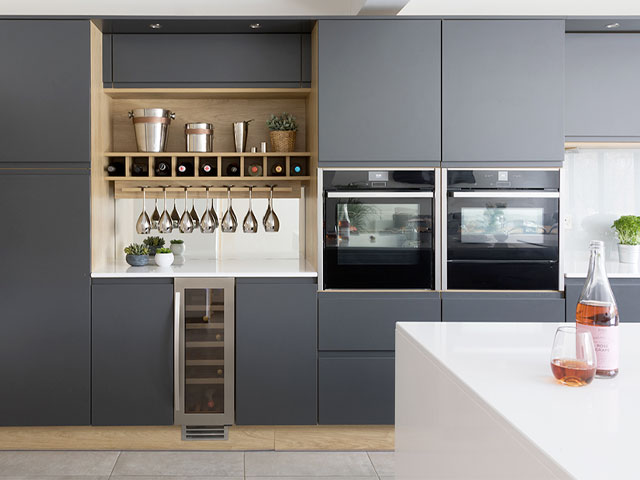 modern grey kitchen cabinets with open wine rack and glass storage 