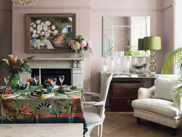pale pink dining room with green accents in a period property