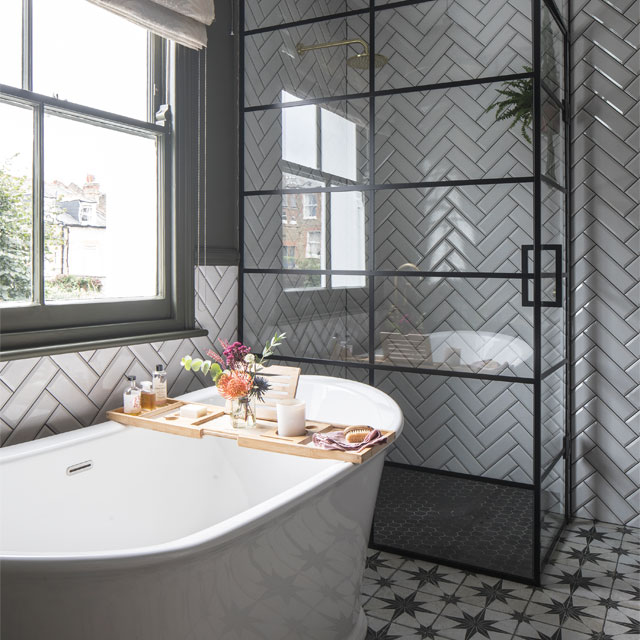 remodelled bathroom with crittal-style shower doors, metro tiles and patterned tile floor