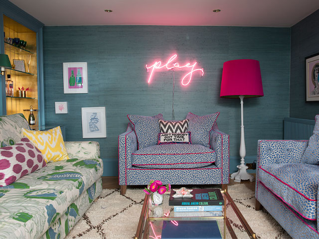 fun family house basement den with colourful decor and neon lights