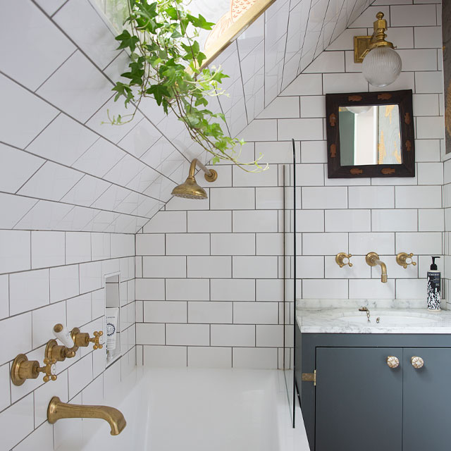 The Pink House bathroom has white metro tiles but flashes of playfulness elsewhere