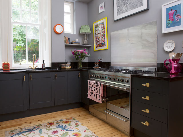 dark moody kitchen with flashes of colour in the accessories