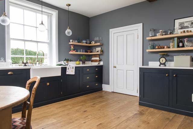 kitchen with pantry blue DeVol kitchen cabinets and brass handles