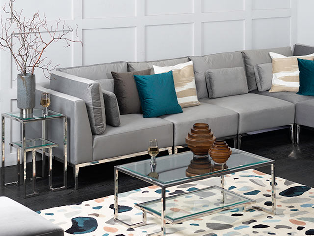 Terrazzo rug in white panelled living room with grey sofa