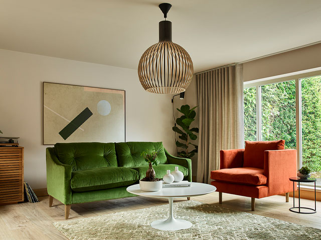 tiktok interior trends: Arlo & Jacob's 70s inspired sofa design in living room decorated in green, orange and brown
