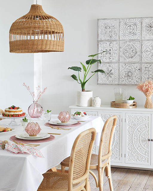 Rattan lampshade and chairs in 70s boho trend