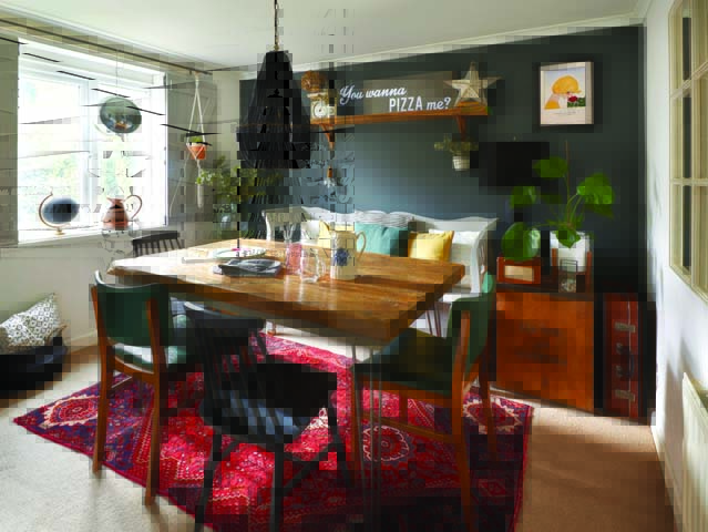 dining room makeover ideas: a rich feature wall in gun metal grey paired with Persian rug