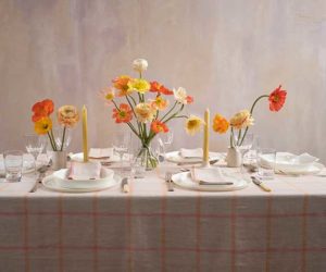 Spring tablescaping ideas pink square tablecloth decorated with orange and yellow flowers