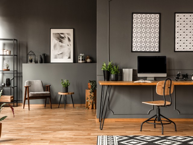 LVT Luxury Vinyl Tile flooring in a home office with grey walls and wooden furniture