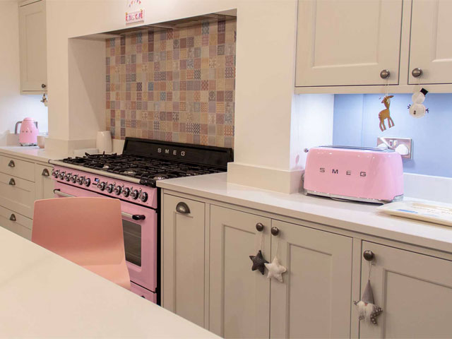 pink accessories in grey kitchen