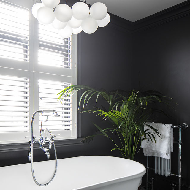 modern bubble chandelier in a Victorian-style bathroom