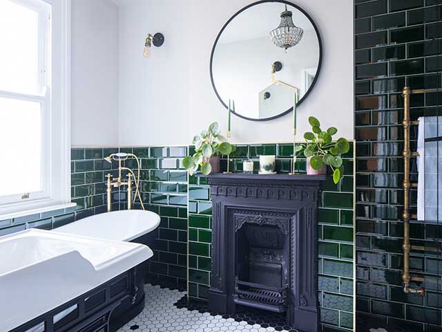 Black fireplace in Victorian bathroom makeover