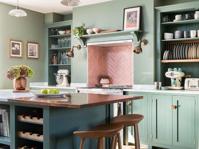 Pink kitchen tiles with green painted walls in a real home