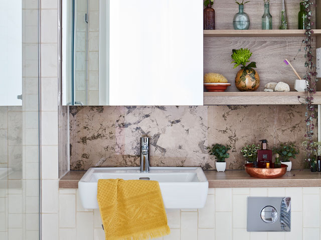 modern bathroom with mirror cabinet and pink marble splashback