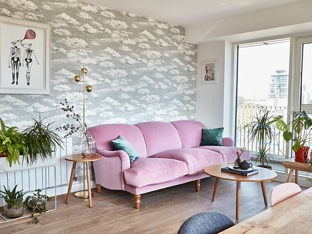 Open-plan living room diner with cloud wallpaper by Sian Zeng and blush pink sofa