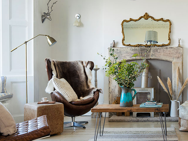 living room with period fireplace and neutral decor scheme