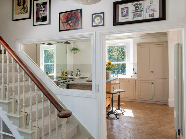 hallway with window over the stairs to let in extra light from the kitchen extension