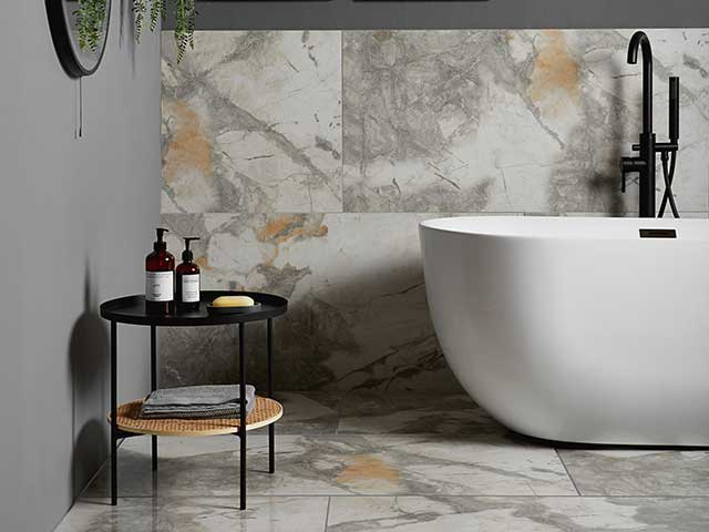 Marble white tiles on floor and ceiling with white freestanding bath
