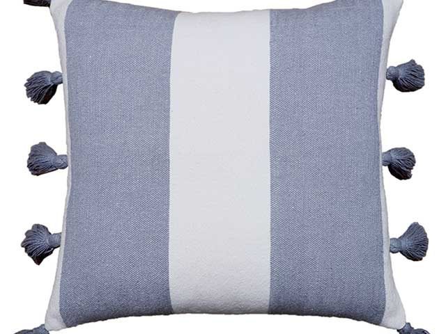 blue and white stiped cushion on white background