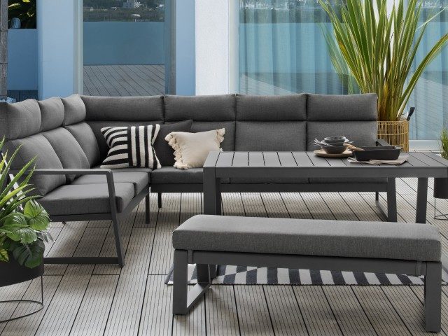 grey corner outdoor sofa set with table and bench in dark grey