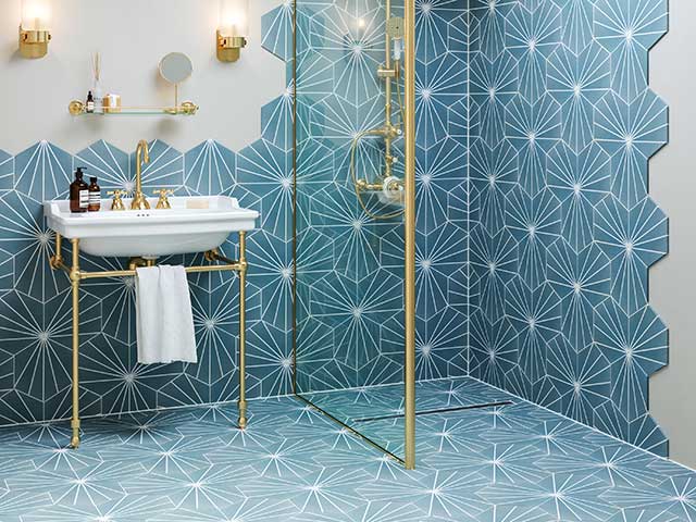 blue patterned bathroom tiles on floor and ceiling