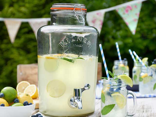 lemon drinks dispenser with glasses and straws