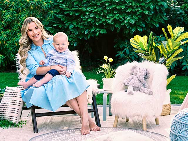 Georgia Kousoulou and Brody in outdoor part of nursery