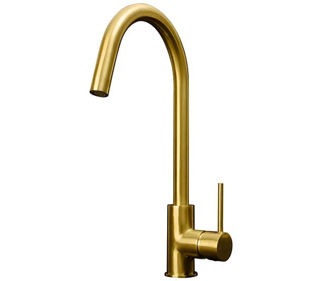 gold kitchen tap on white background