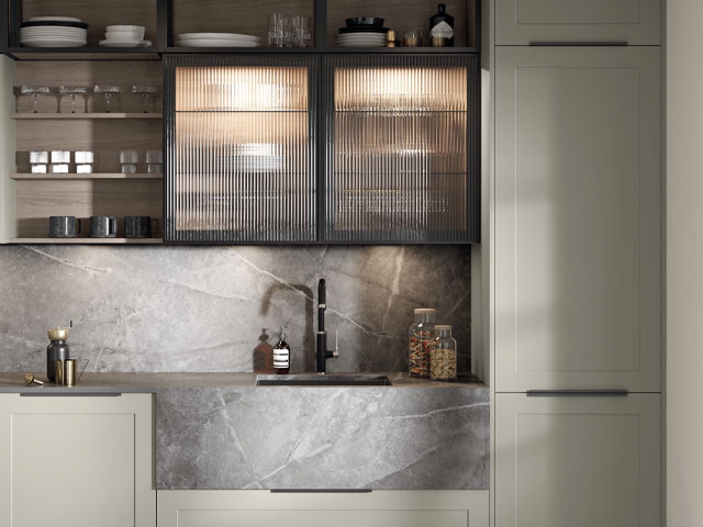 mixed material kitchen with putty cabinets with reeded glass cabinets and marble sink worktop