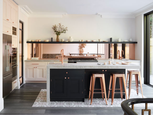 mixed material kitchen: pink metallic splashback with marble island