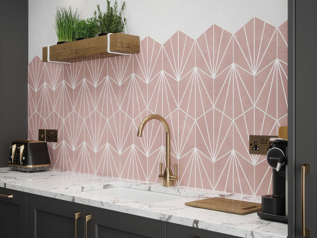 pink kitchen tiles in art deco style with contrasting dark green cabinets