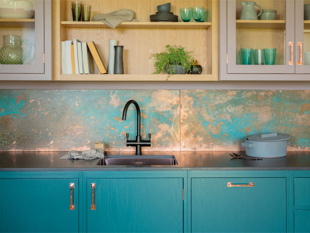 striking splashback with blue and copper oxidised metal splashback