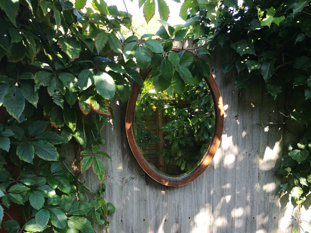 hang an old mirror in the garden