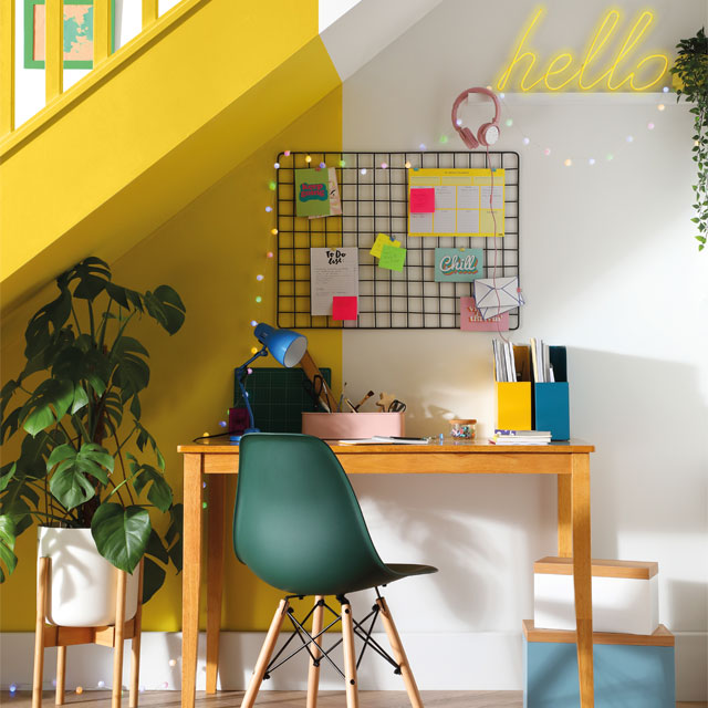under-the-stairs office with yellow paint job
