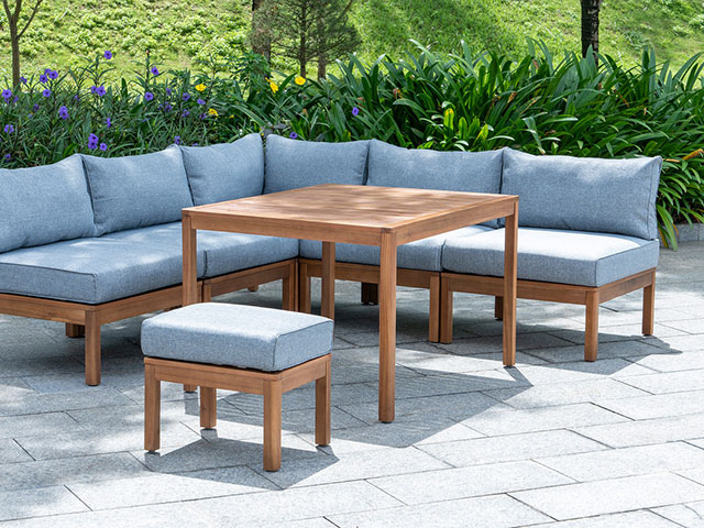 Lounge wooden garden dining set on concrete 