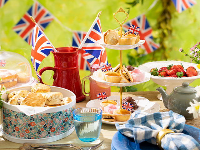 Union jack decorated outdoor table at coronation themed party