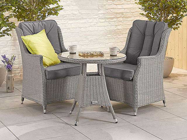 Garden dining sets rattan two seater and small table on tiled outdoor flooring