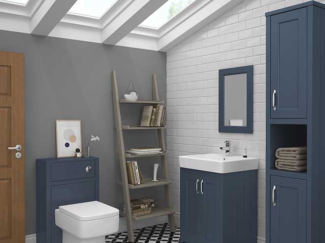 bathroom cabinets in teal blue with white sanitaryware in loft conversion bathroom