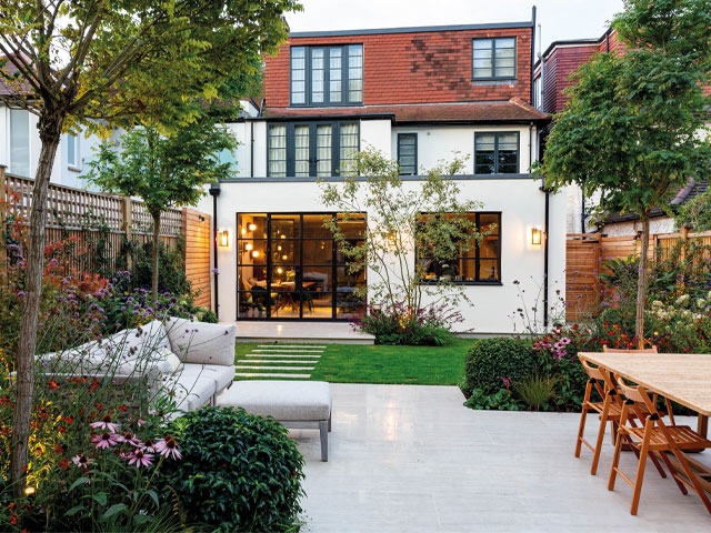 garden lighting making the most of a zoned garden with lounging and dining areas