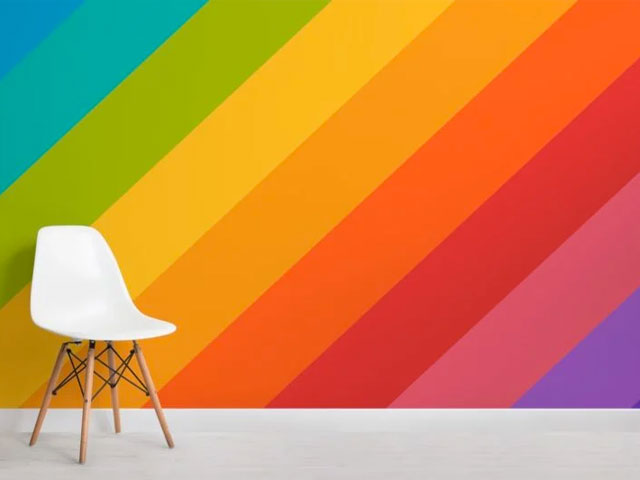 Pride decoration ideas: rainbow wallpaper mural with white scandi-style dining chair, hovia