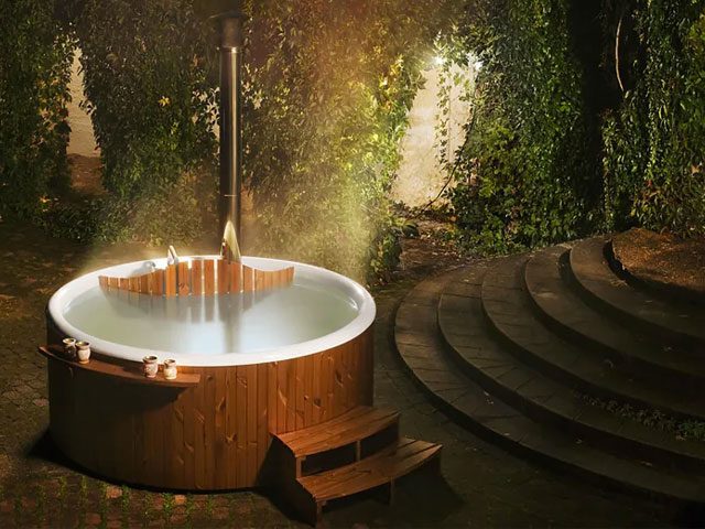 wooden hot tub in magical garden oasis