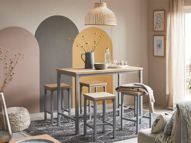 curve appeal with pastel painted arches in dining room with bar-height table and stools