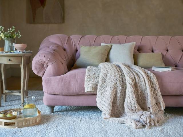 cottagecore: pink squashy chesterton sofa with chunky knit throw, cushions and rug