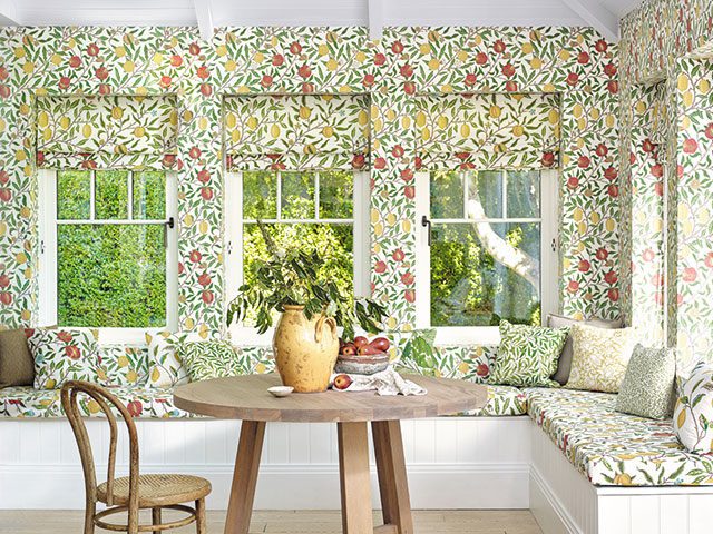 colouful william morris wallpaper with matching blinds