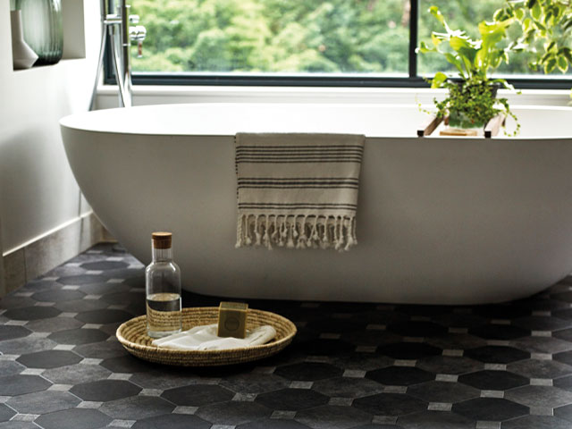 grey hexagonal bathroom tiles used as a neutral in an earthy scheme