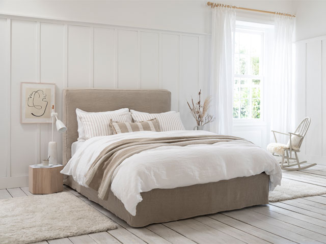 neutral home decor: bedroom dressed in off-whites, caramel and linen shades 