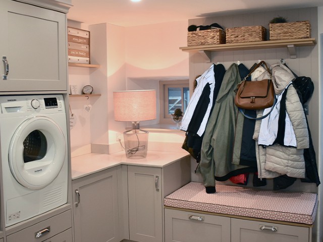 utility boot room ideas: functional space with grey cabinets and room to hang coats