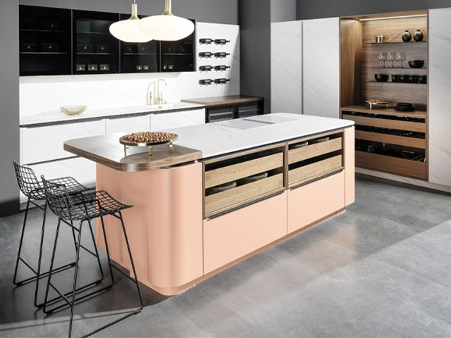 kitchen island with curved edges in a modern handless kitchen